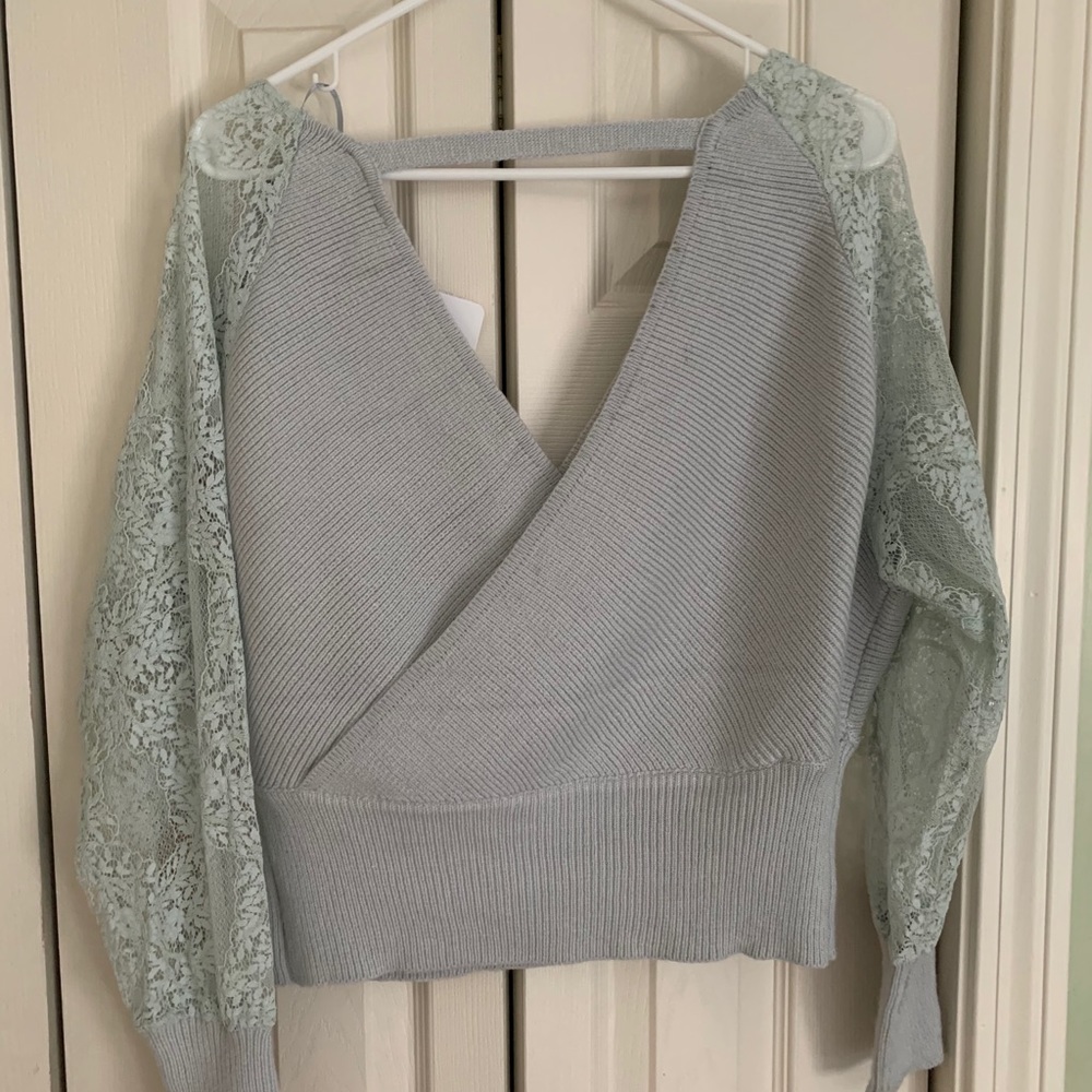 NWT top with lace sleeves - size is M/L.